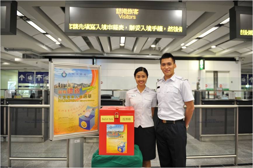Immigration Control Officers welcome visitors to Hong Kong.