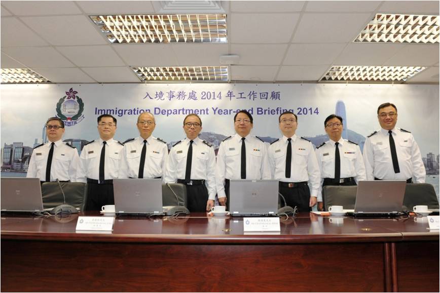 The Director of Immigration, Mr Chan Kwok-ki (fourth right), chairs the Immigration Department's year-end review of 2014 today (February 12).