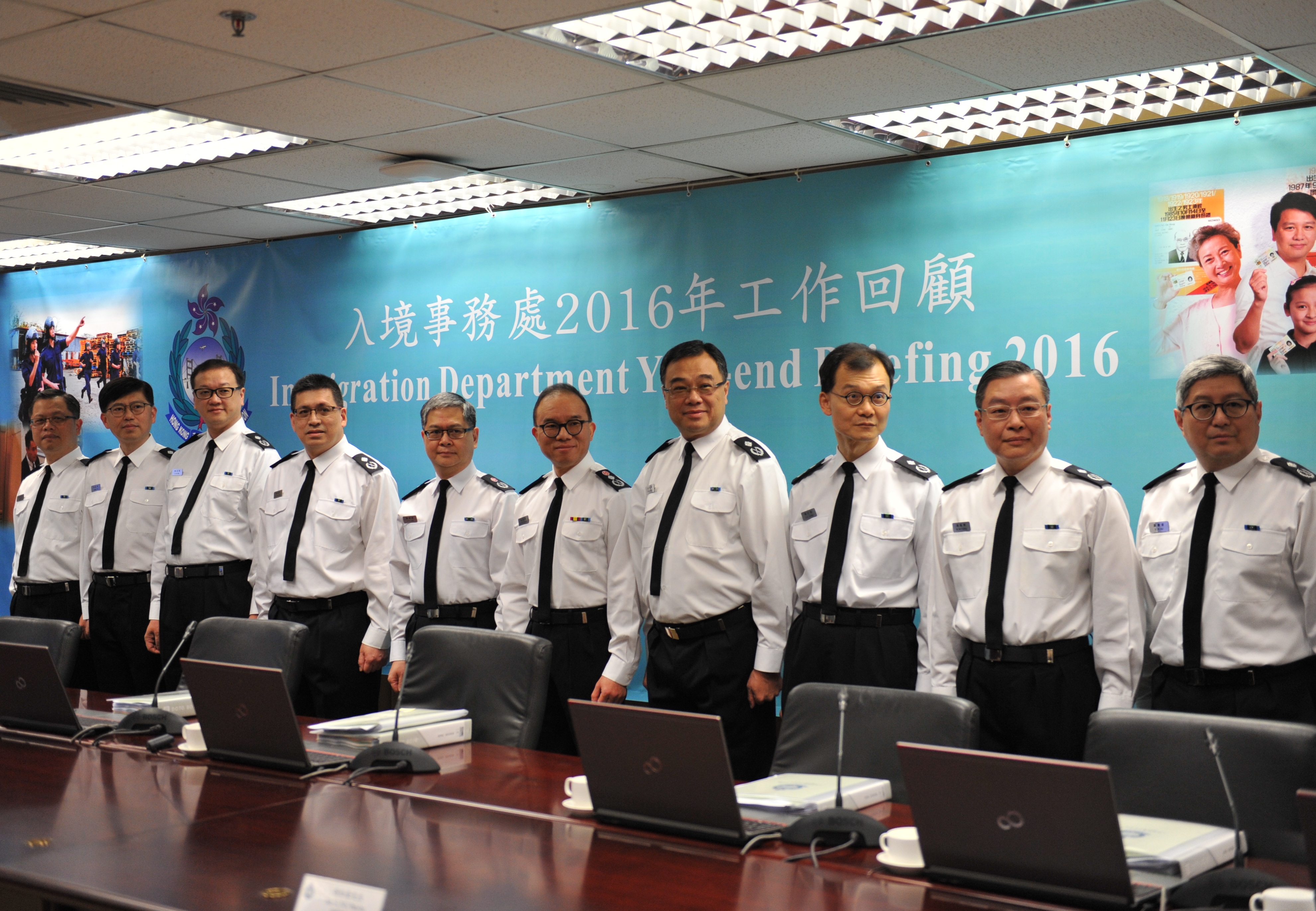 The Director of Immigration, Mr Tsang Kwok-wai (fifth right), chairs the press conference of the Immigration Department's year-end review of 2016 today (January 26).