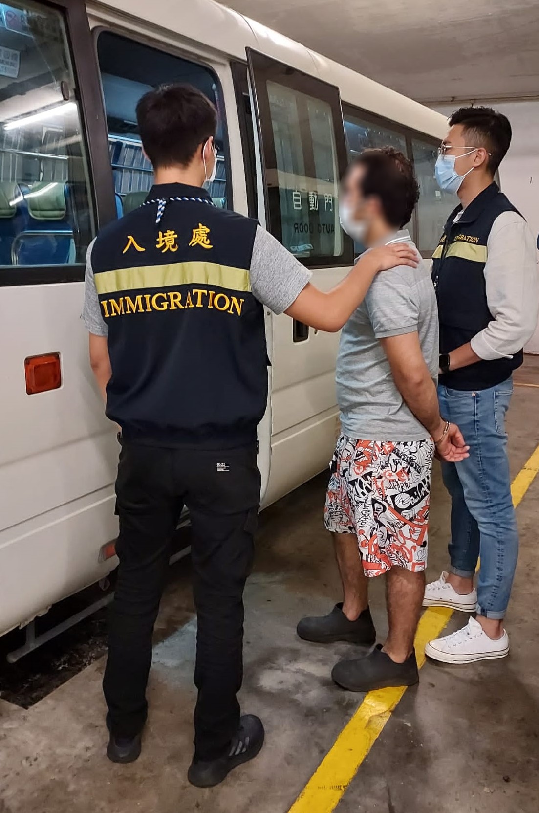 Photo shows a suspected illegal worker arrested during the operations.