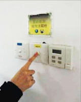 Prominent labels reminding staff to switch off lights after use.
