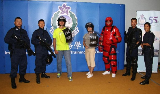 The tactical training outfits and gears of the Immigration Department are displayed on the Immigration Service Institute of Training and Development Open Day today (July 31).