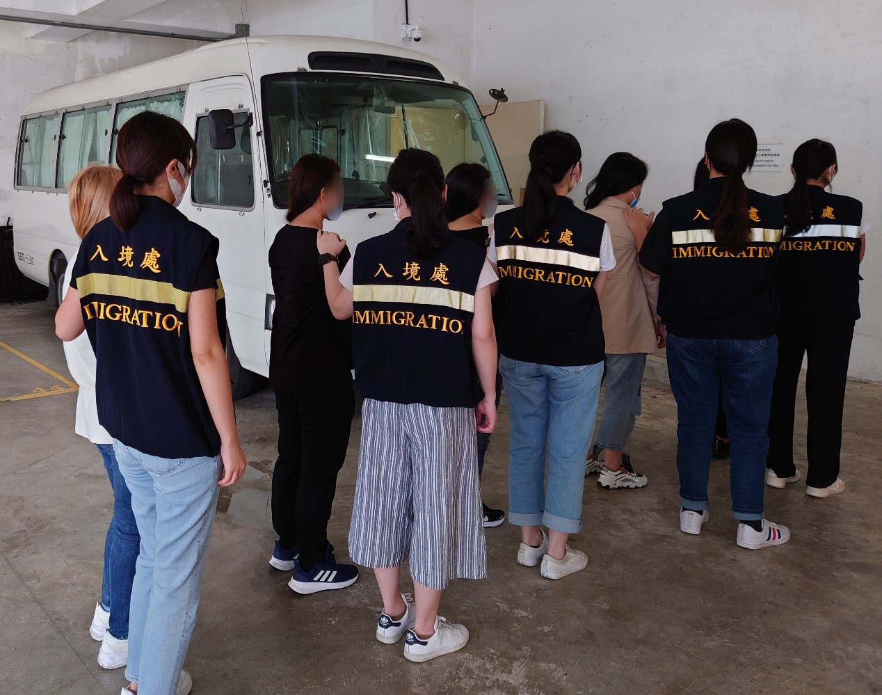 Photo shows suspected illegal workers arrested during the operations.