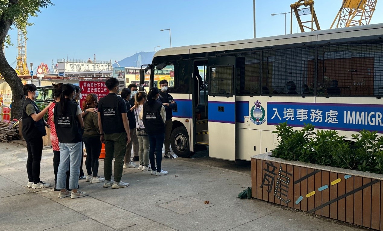 Photo shows suspected illegal workers arrested during an operation.