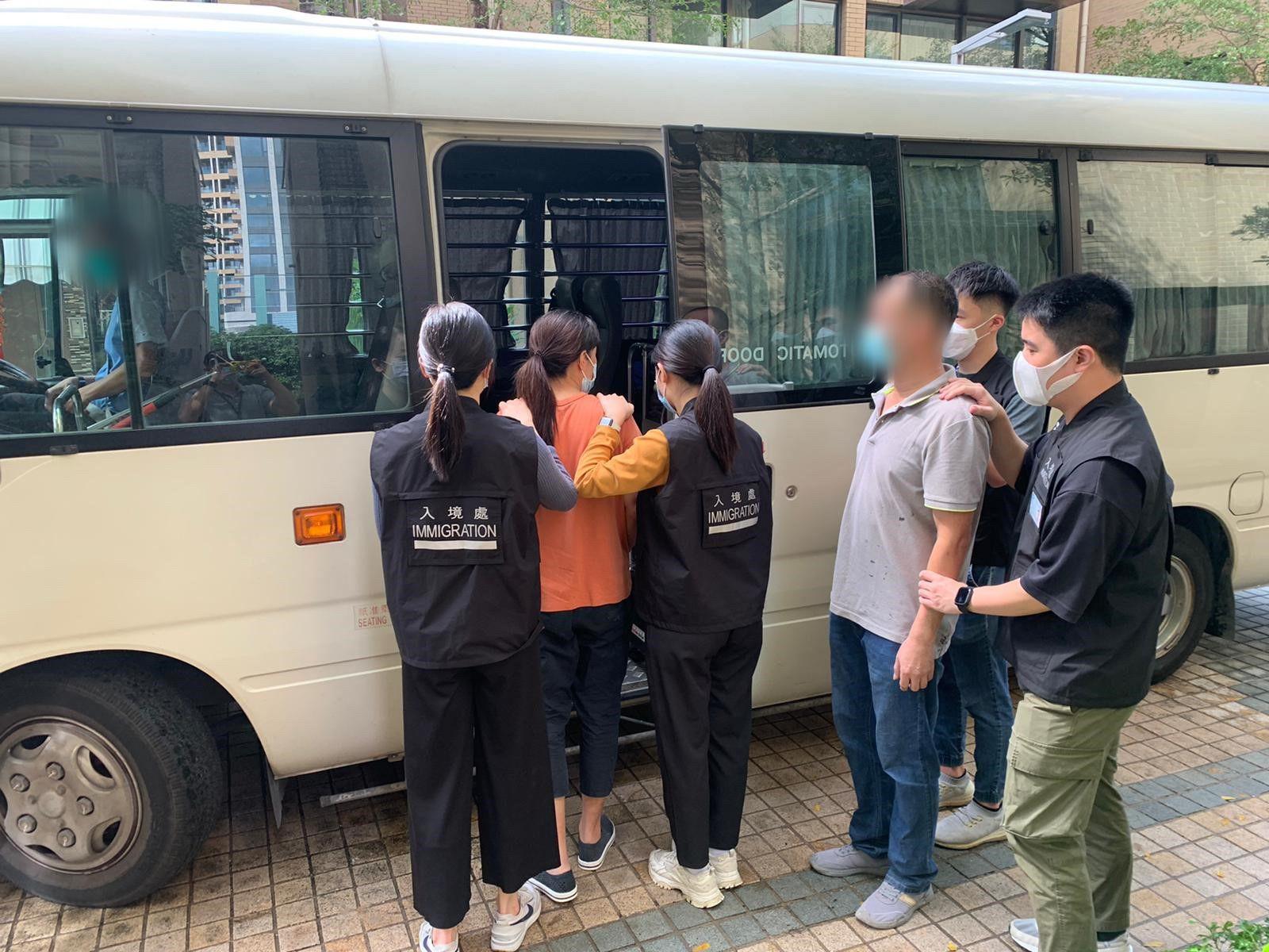 Photo shows suspected illegal workers arrested during an operation.