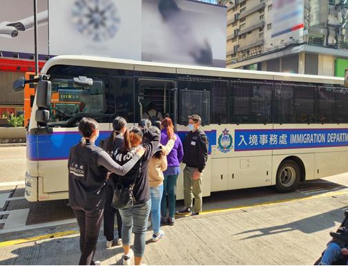 Photo shows suspected illegal workers arrested during an operation.