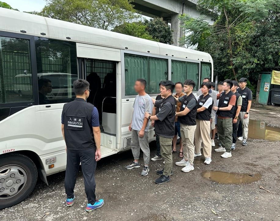 Photo shows suspected illegal workers arrested during an operation.