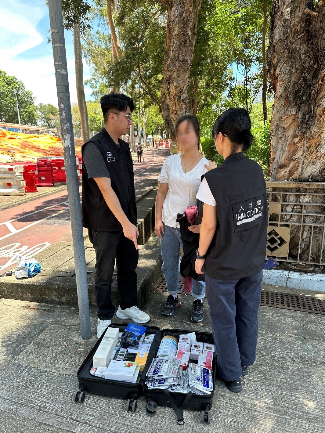 Photo shows a Mainland visitor involved in suspected parallel trading activities and her goods.