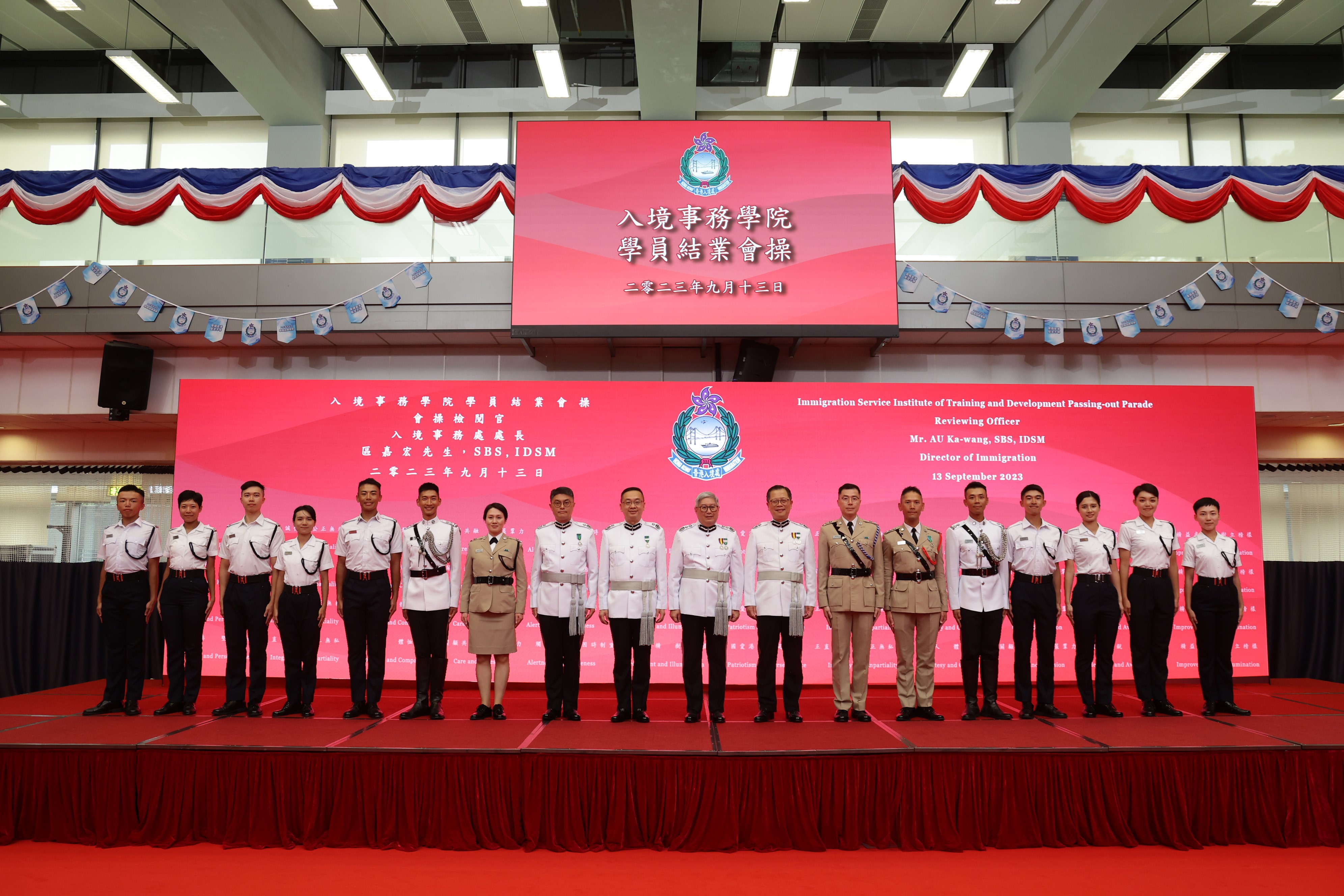 The Director of Immigration, Mr Au Ka-wang (ninth right), is pictured with graduates awarded the 