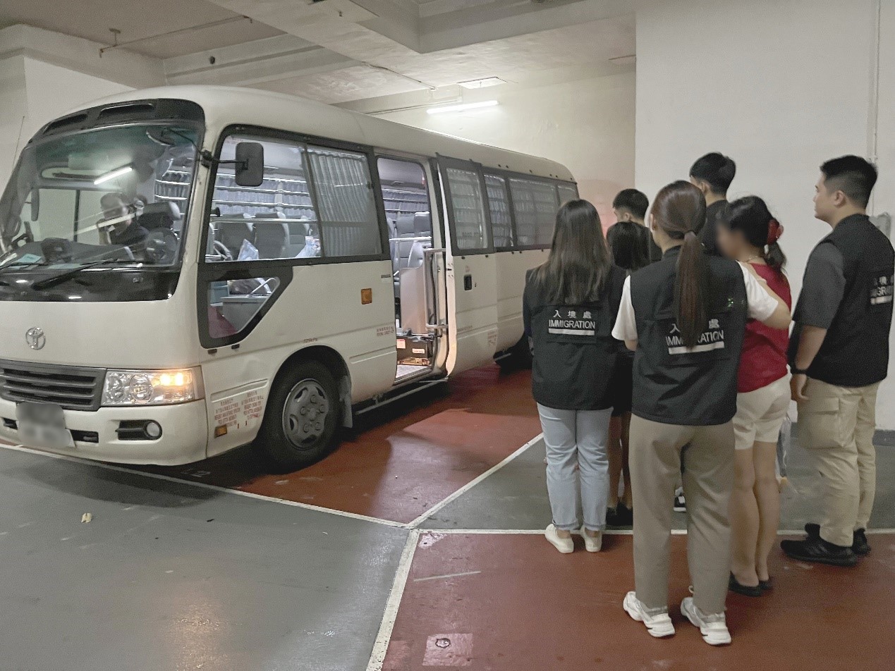 Photo shows suspected illegal workers arrested during an operation.