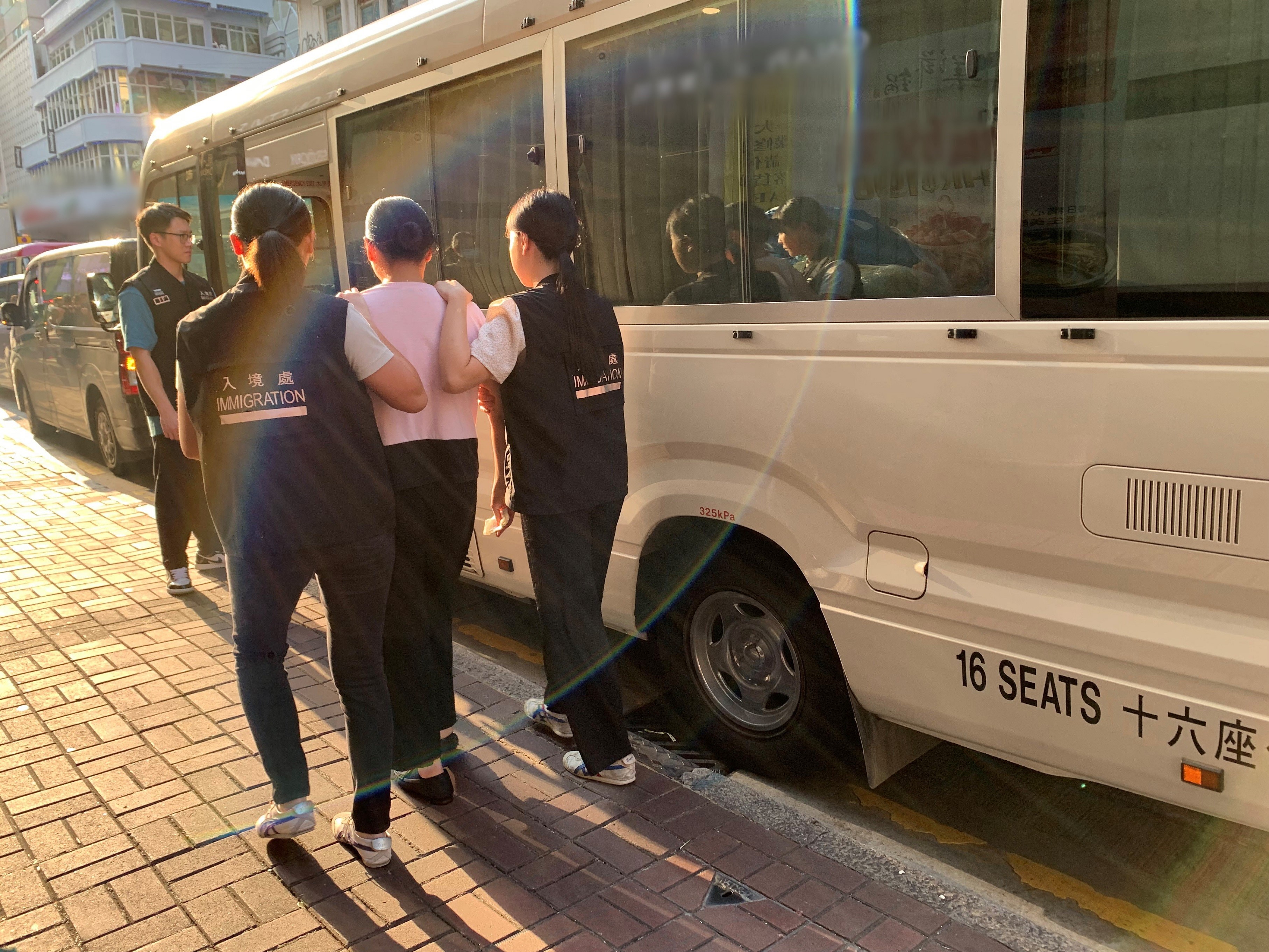 Photo shows suspected illegal workers arrested during an operation.