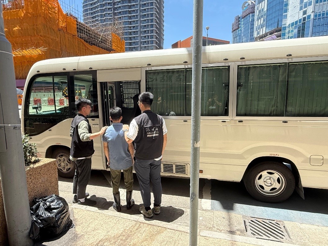 Photo shows a suspected illegal worker arrested during an operation