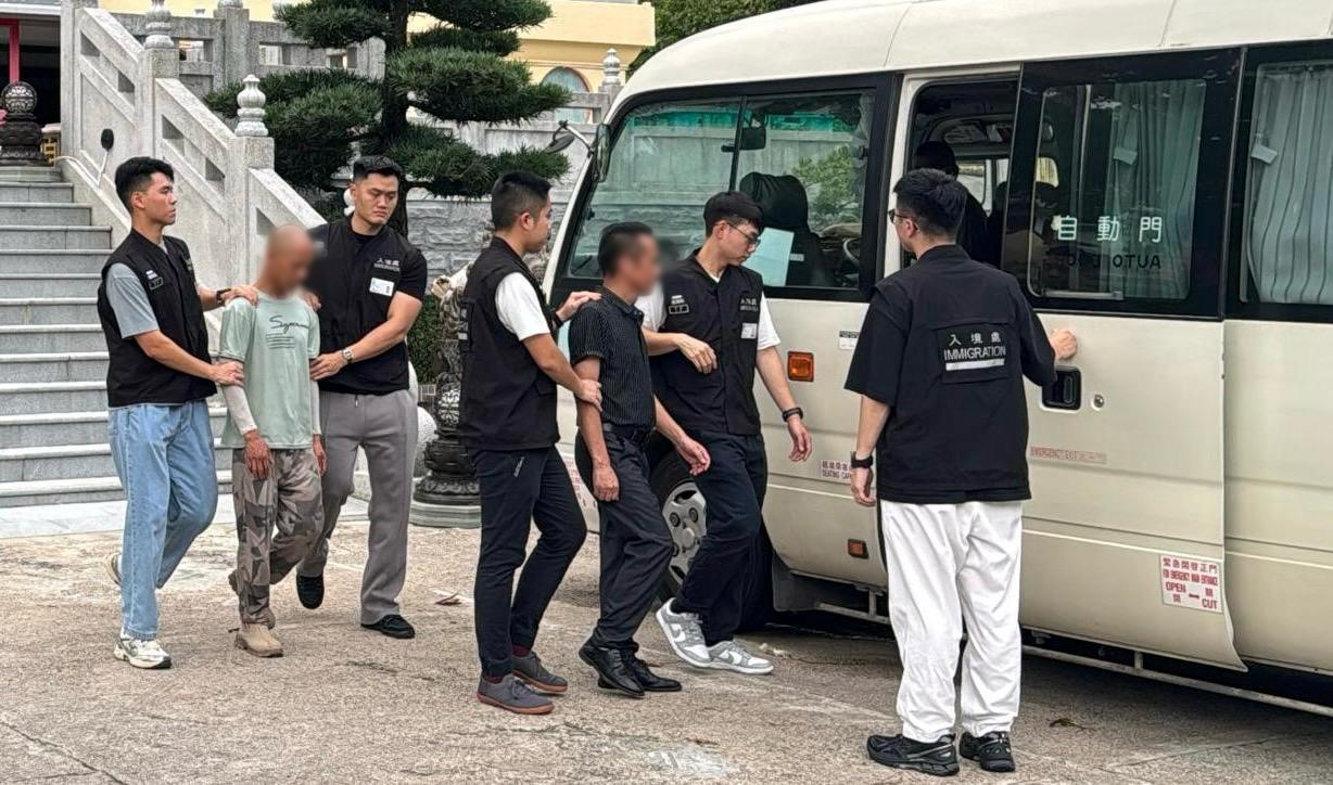 Photo shows suspected illegal workers arrested during an operation