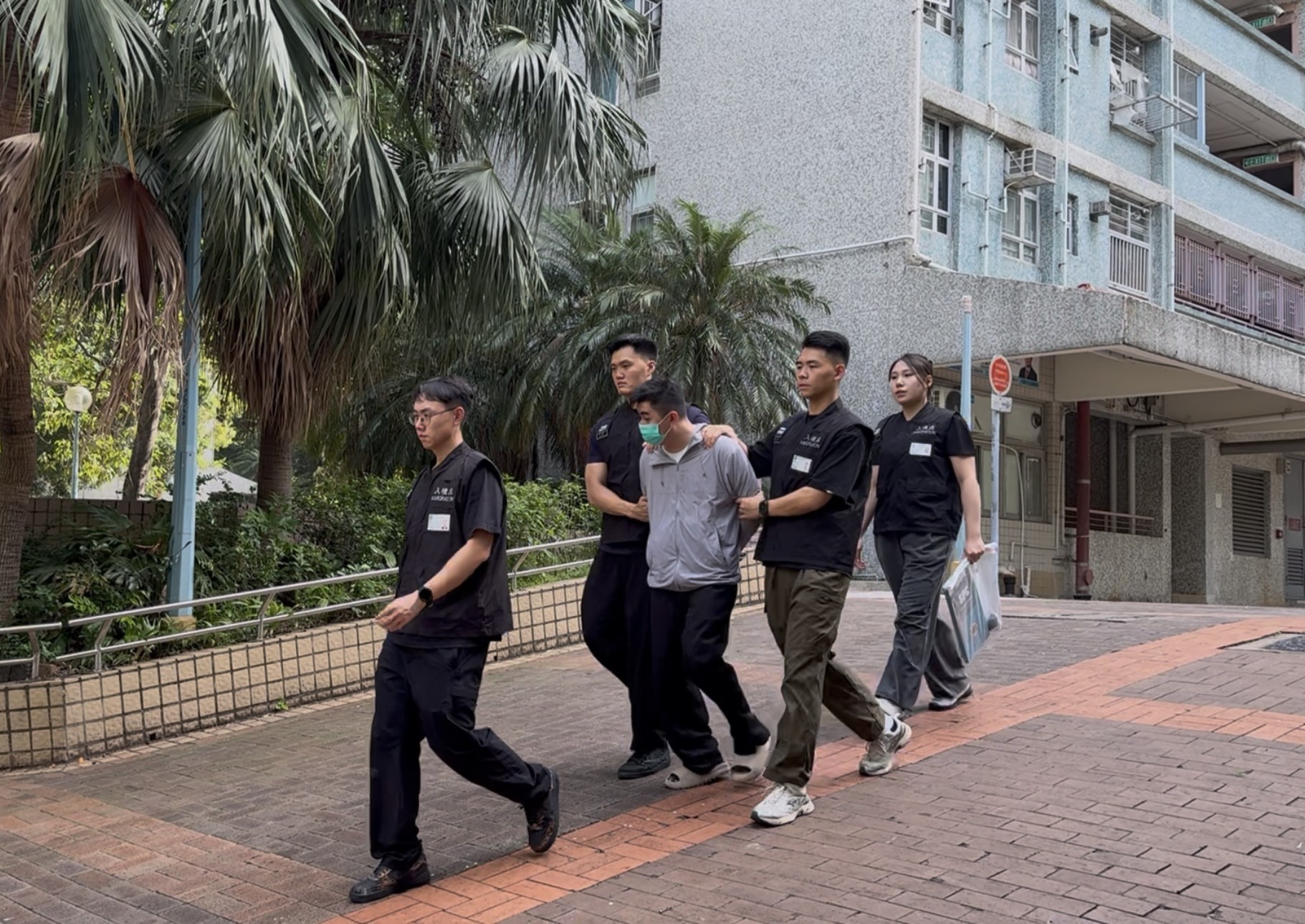 Photo shows a suspected illegal worker arrested during an operation
