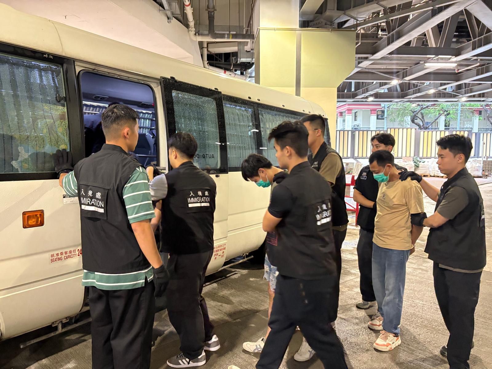 Photo shows suspected illegal workers arrested during an operation