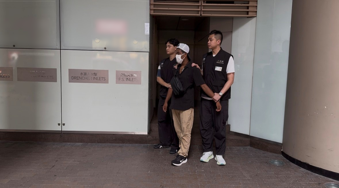 Photo shows a suspected illegal worker arrested during an operation