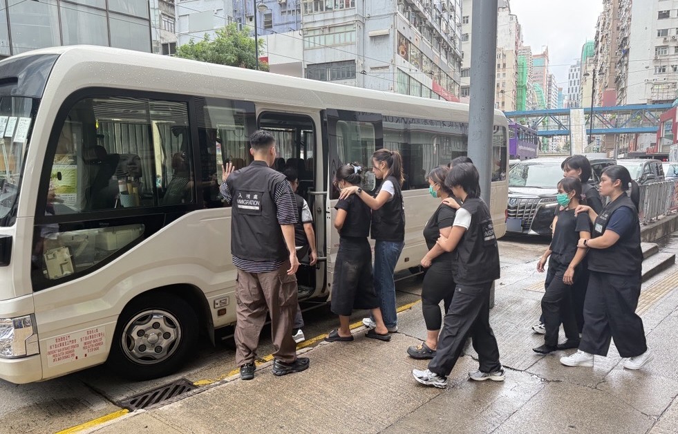 Photo shows suspected illegal workers arrested during an operation