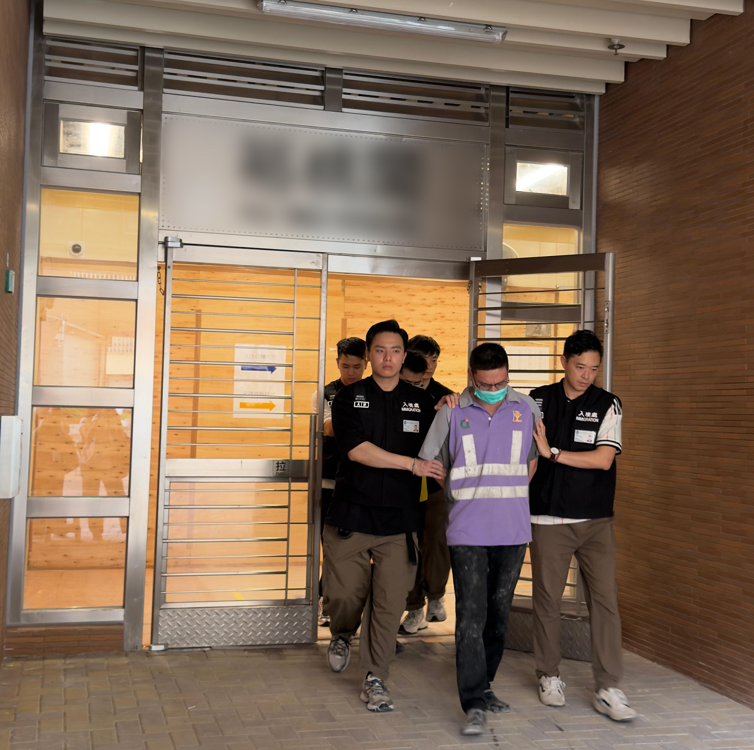 Photo shows suspected illegal workers arrested during the operation