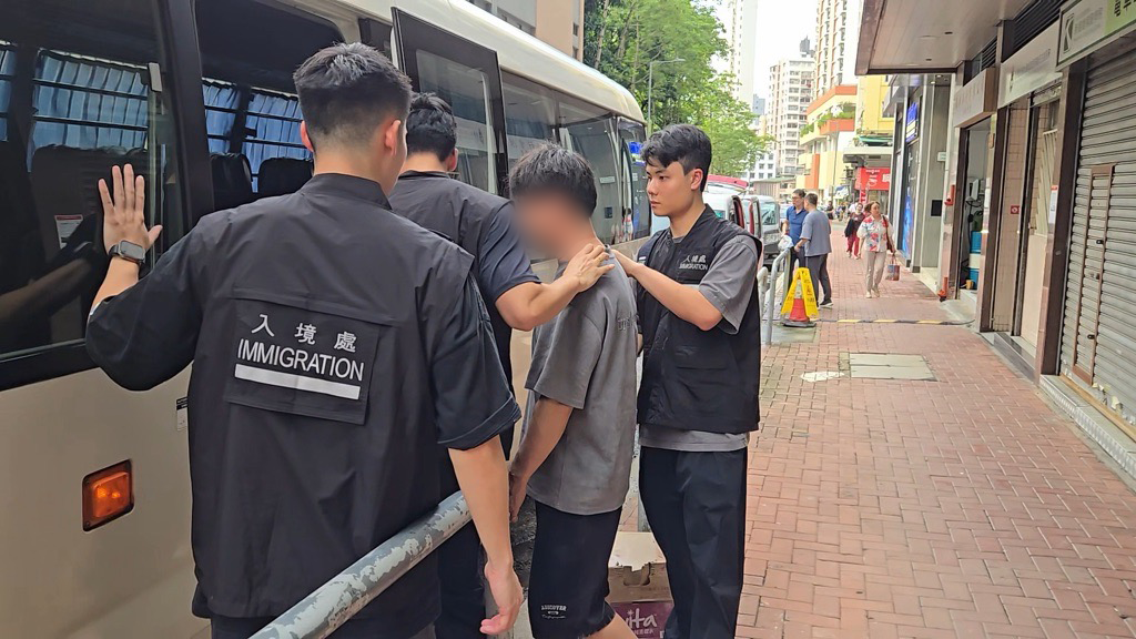 Photo shows suspected illegal workers arrested during an operation