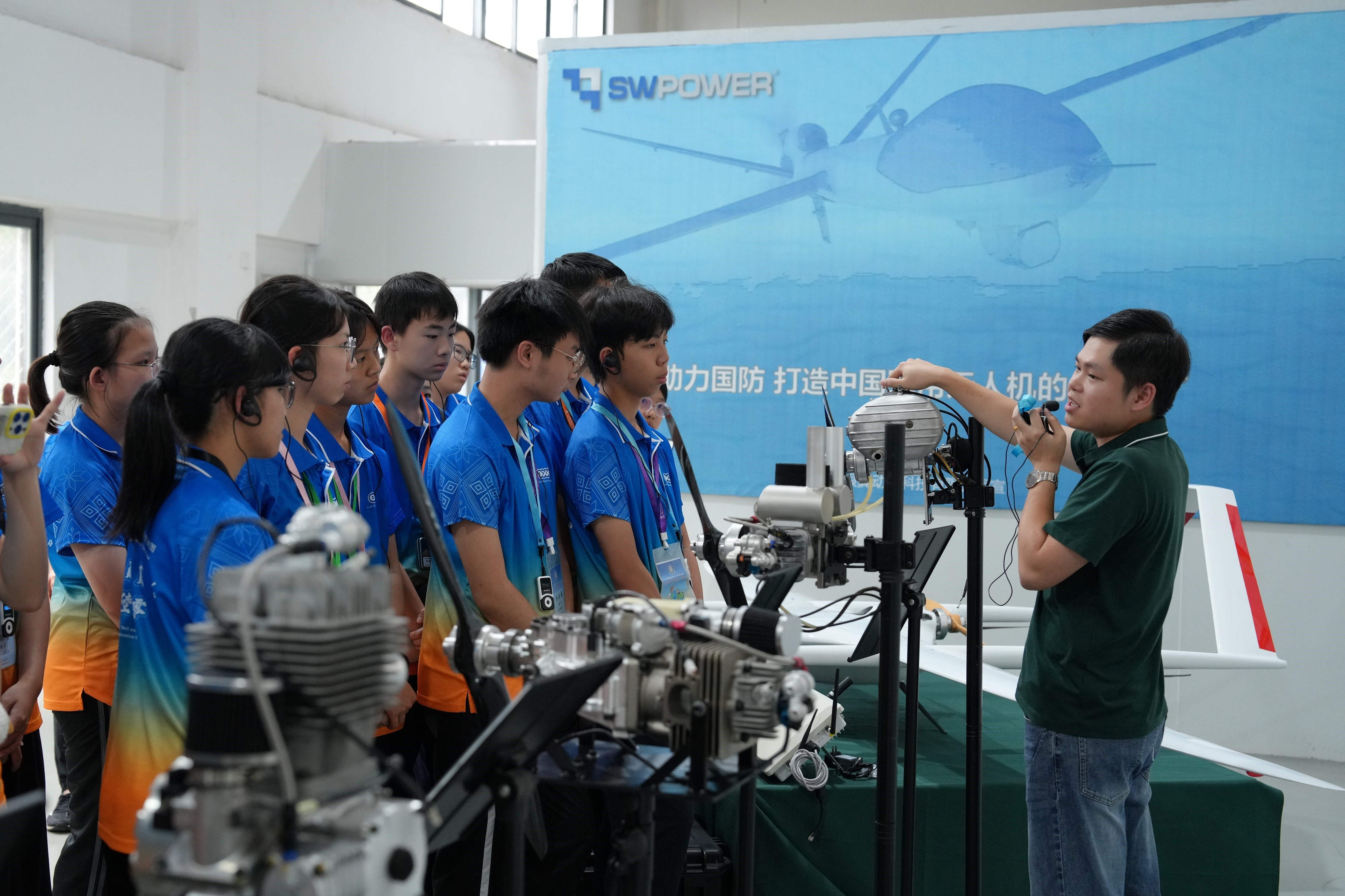 Members of the IDYL Belt and Road Exploration Tours: Guangxi Tour visit the Guangxi Silver Wing Power Technology Company Limited on July 21 to learn about the country's development of high-tech industries.
