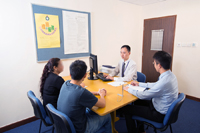 Staff of the Torture Claim Assessment Section conducting assessment interview with a torture claimant in the presence of his legal representative and with the assistance of an interpreter.