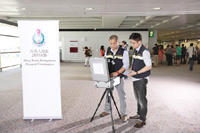 Immigration officers using the FACES to verify the identity of suspected passengers.